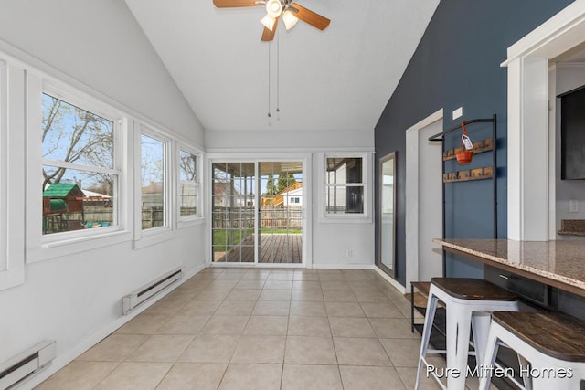 unfurnished sunroom with a baseboard heating unit