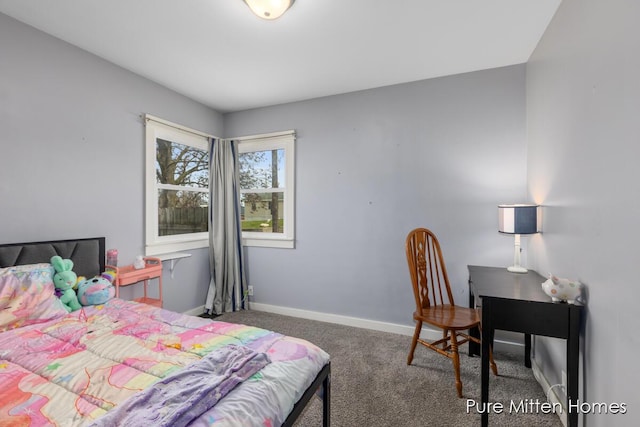 bedroom featuring baseboards and carpet