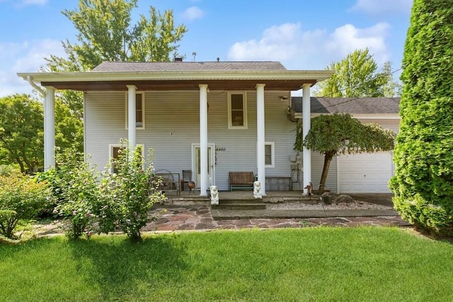 6460 E Galien Buchanan Rd, Buchanan, MI 49107 - exterior space with a porch, a lawn, and an attached garage