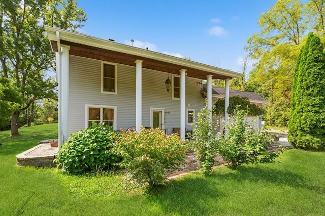 6460 E Galien Buchanan Rd, Buchanan, MI 49107 - rear view of property featuring a lawn and covered porch