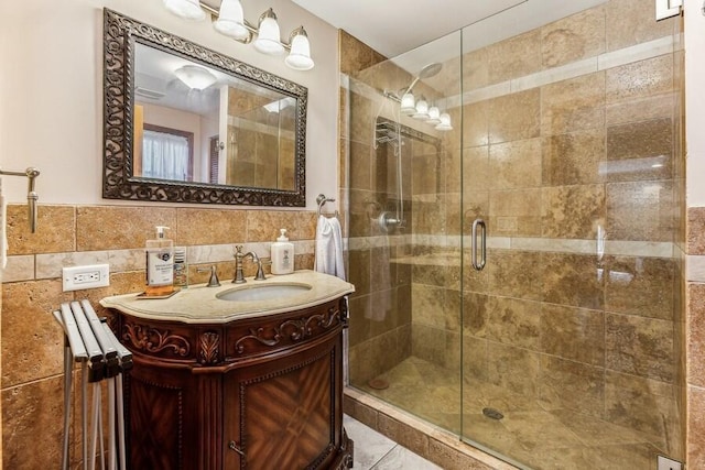 6460 E Galien Buchanan Rd, Buchanan, MI 49107 - bathroom with vanity, tile walls, and a shower stall