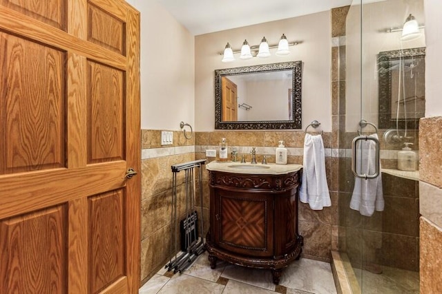 6460 E Galien Buchanan Rd, Buchanan, MI 49107 - bathroom with vanity, tile walls, wainscoting, and a shower stall