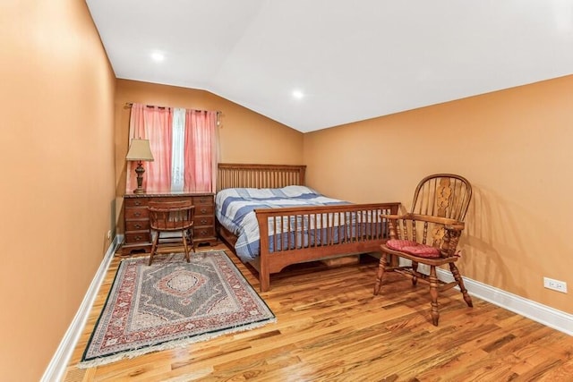 6460 E Galien Buchanan Rd, Buchanan, MI 49107 - bedroom with baseboards, vaulted ceiling, and wood finished floors