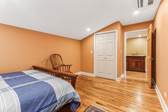 6460 E Galien Buchanan Rd, Buchanan, MI 49107 - bedroom with light wood-style floors, baseboards, visible vents, and lofted ceiling