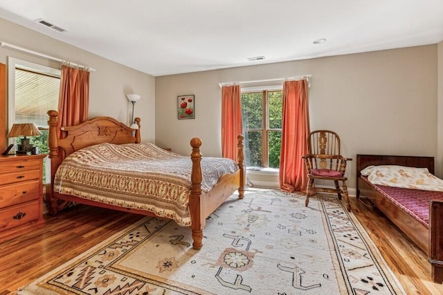 6460 E Galien Buchanan Rd, Buchanan, MI 49107 - bedroom with visible vents and light wood finished floors
