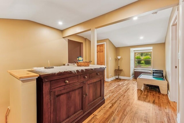 6460 E Galien Buchanan Rd, Buchanan, MI 49107 - bar featuring baseboards, vaulted ceiling, recessed lighting, and light wood-style flooring