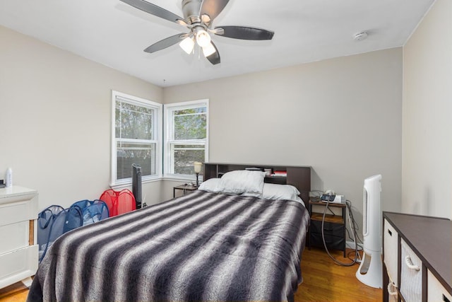bedroom featuring ceiling fan and wood finished floors