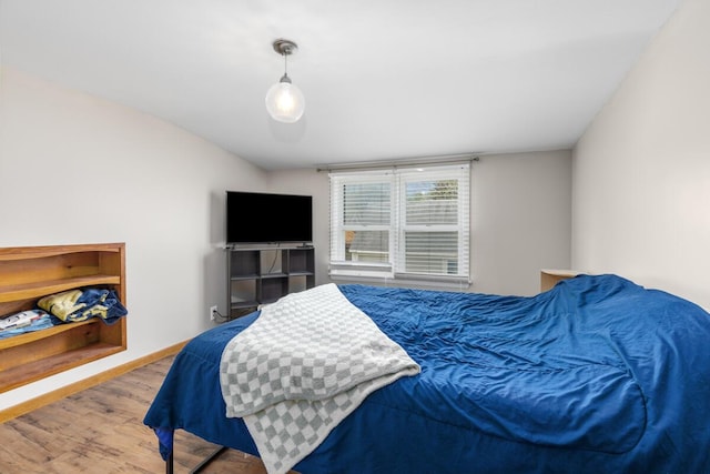 bedroom with wood finished floors