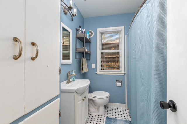 full bath with tile patterned floors, baseboards, vanity, toilet, and a shower with shower curtain