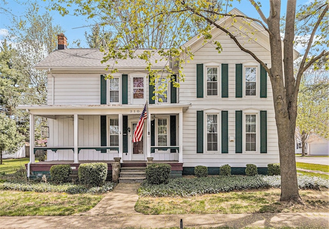 310 E Unadilla St, Pinckney, MI 48169 - view of front of property with a porch and a chimney