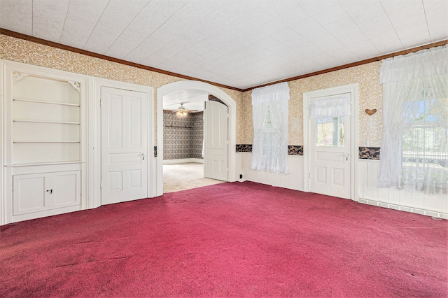 310 E Unadilla St, Pinckney, MI 48169 - interior space featuring crown molding, a ceiling fan, wallpapered walls, and visible vents