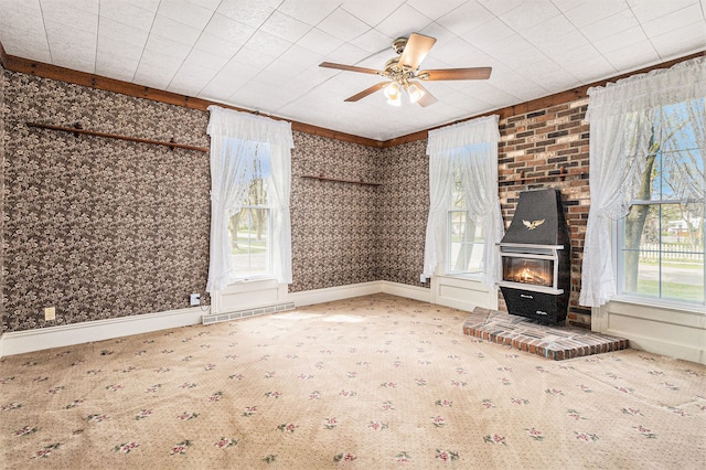 310 E Unadilla St, Pinckney, MI 48169 - unfurnished living room featuring carpet floors, ceiling fan, and visible vents