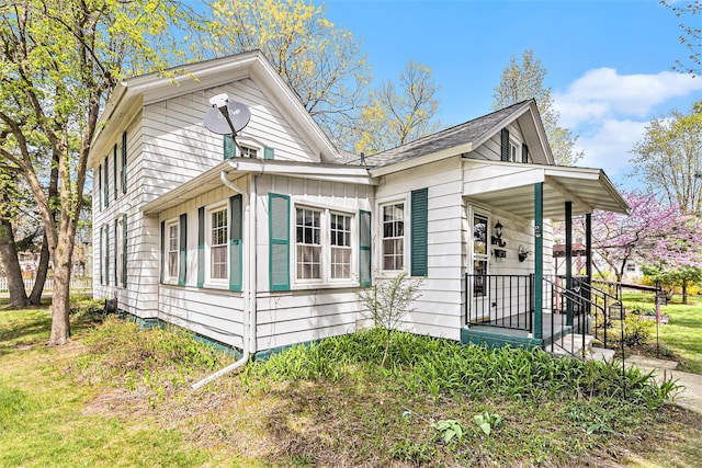 310 E Unadilla St, Pinckney, MI 48169 - view of home's exterior featuring board and batten siding