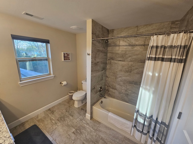 full bathroom with baseboards, shower / tub combo, toilet, and visible vents