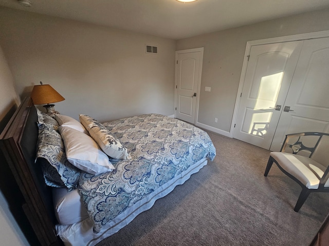 carpeted bedroom with baseboards and visible vents