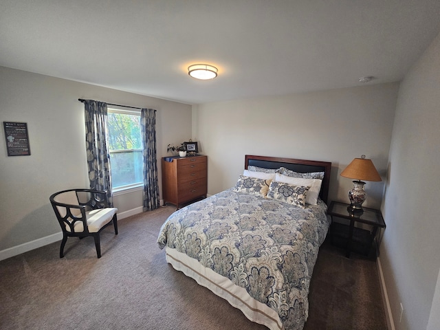 bedroom featuring baseboards and carpet flooring