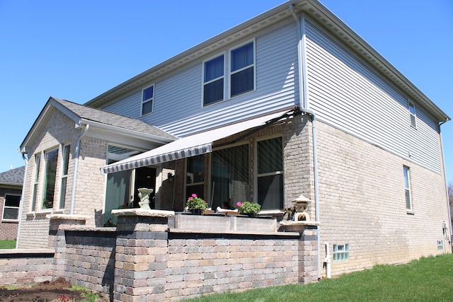 exterior space with brick siding