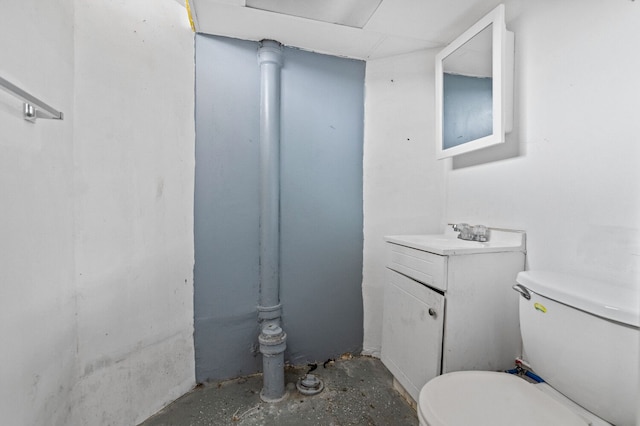 half bath featuring toilet and vanity