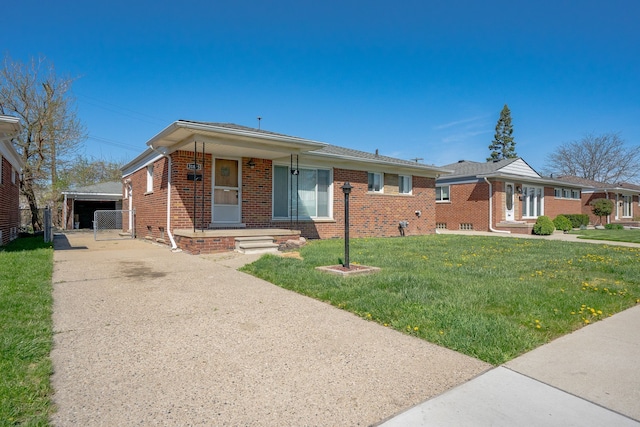 31825 Eveningside, Fraser, MI 48026 - view of front of property featuring brick siding, a front yard, driveway, and a gate