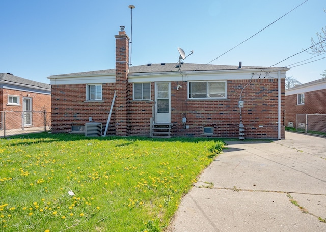 31825 Eveningside, Fraser, MI 48026 - rear view of property featuring entry steps, brick siding, and a chimney
