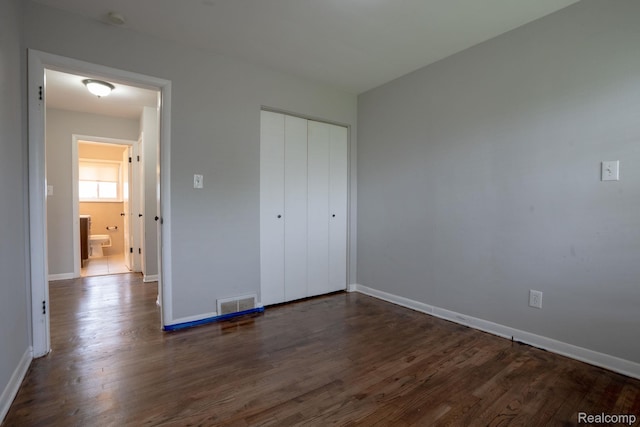 31825 Eveningside, Fraser, MI 48026 - unfurnished bedroom with dark wood-type flooring, baseboards, and a closet