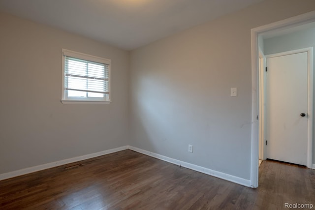 31825 Eveningside, Fraser, MI 48026 - empty room with dark wood-style flooring and baseboards
