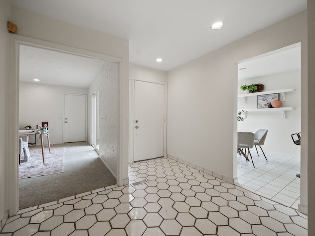 foyer featuring recessed lighting and light floors