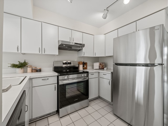 kitchen featuring light countertops, stainless steel appliances, white cabinetry, and under cabinet range hood
