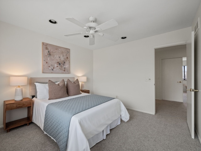 carpeted bedroom featuring baseboards and ceiling fan