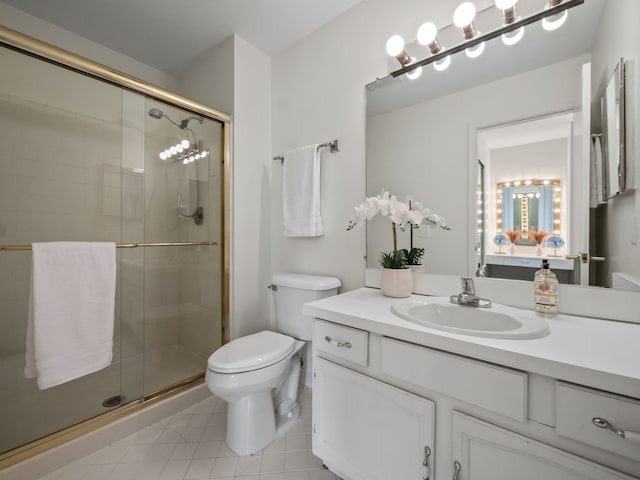 full bathroom with vanity, tile patterned flooring, a stall shower, and toilet