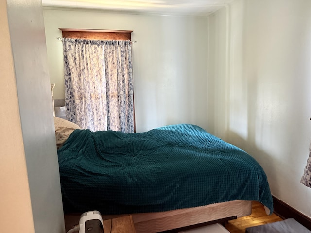 bedroom featuring wood finished floors