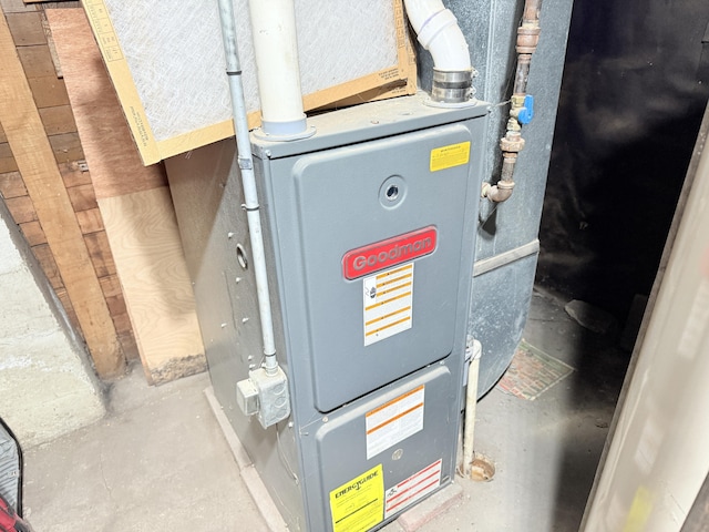 utility room with heating unit