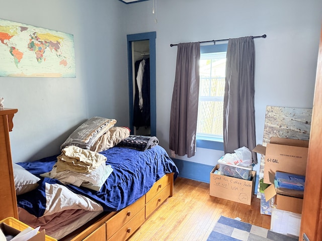 bedroom with hardwood / wood-style floors
