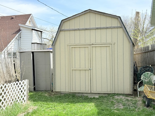 view of shed with fence
