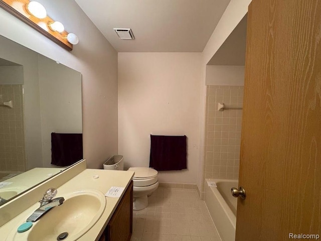 bathroom with visible vents, tile patterned floors, toilet, and vanity