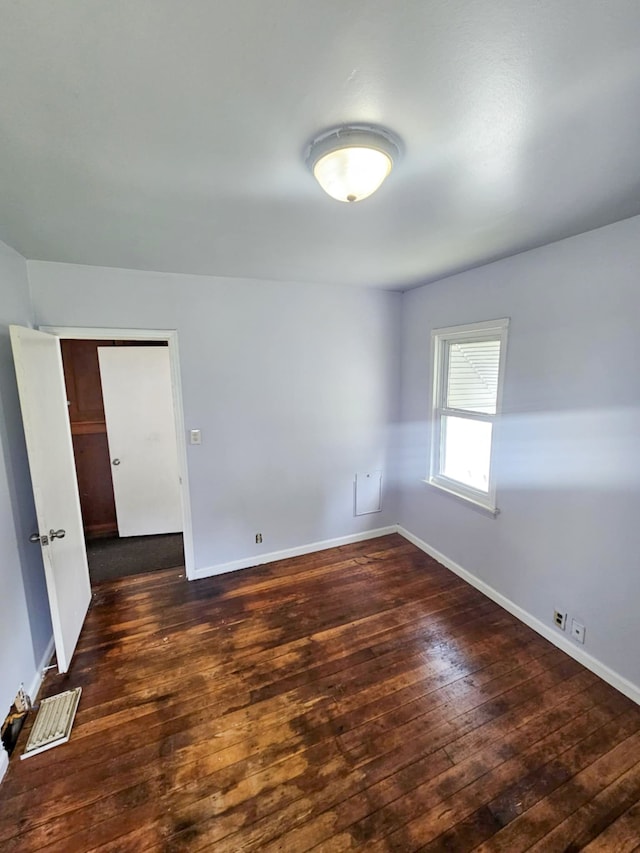 4010 Stolzenfeld Ave, Warren, MI 48091 - spare room featuring baseboards, hardwood / wood-style floors, and visible vents