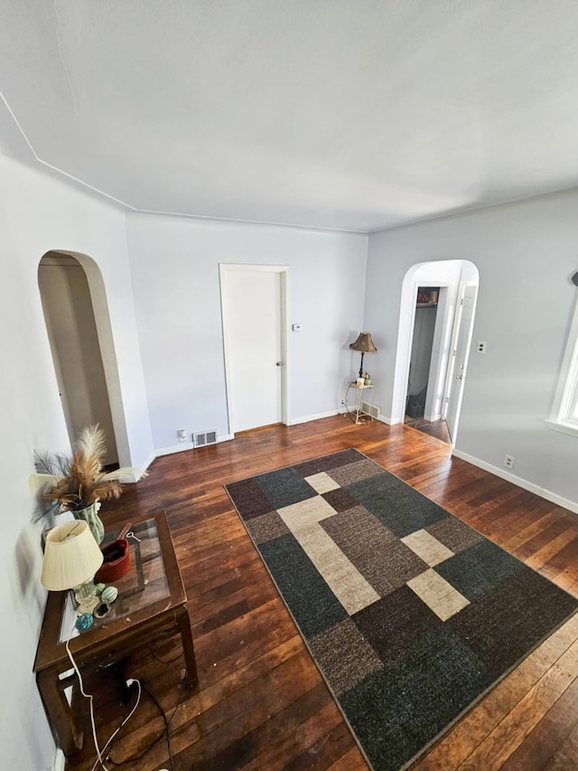 4010 Stolzenfeld Ave, Warren, MI 48091 - interior space featuring visible vents, arched walkways, baseboards, and hardwood / wood-style flooring