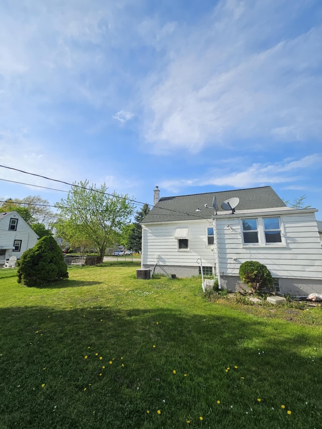 4010 Stolzenfeld Ave, Warren, MI 48091 - rear view of house with a yard and a chimney