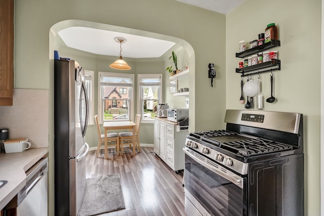1343 Northway St, Ferndale, MI 48220 - kitchen with arched walkways, open shelves, stainless steel appliances, and white cabinetry