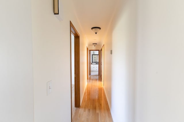 hallway featuring light wood-style floors