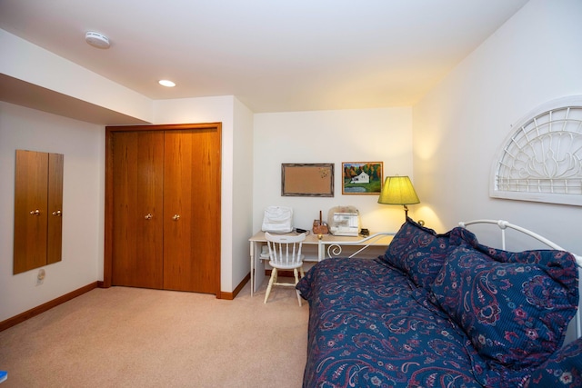 carpeted living area featuring baseboards