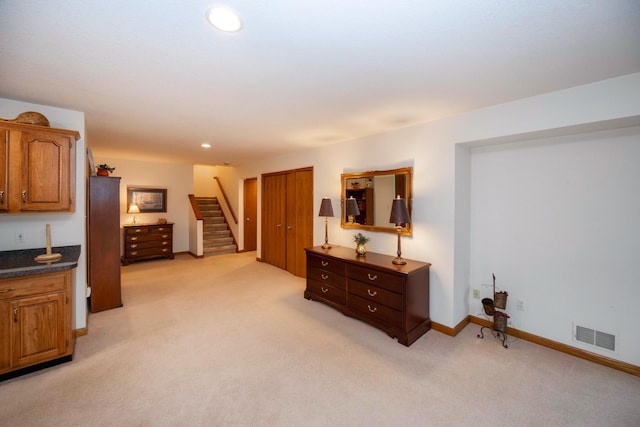 bedroom with baseboards, visible vents, recessed lighting, and light colored carpet