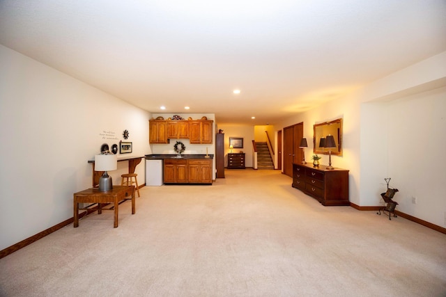 interior space with stairs, baseboards, light colored carpet, recessed lighting, and bar