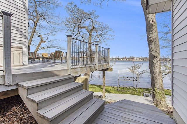 wooden terrace with a water view