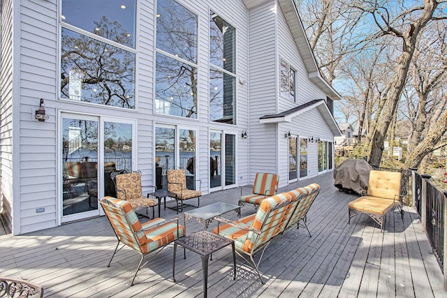 wooden deck with outdoor lounge area