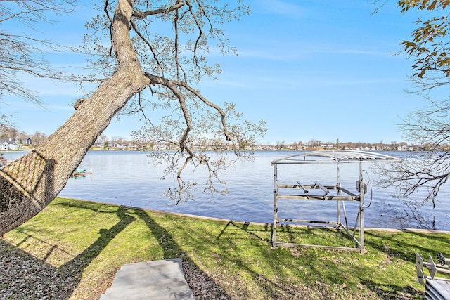 view of water feature with boat lift and a dock