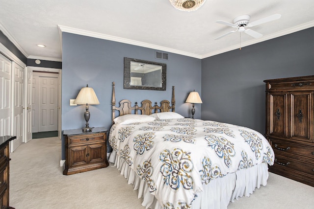 carpeted bedroom featuring crown molding, ceiling fan, and visible vents