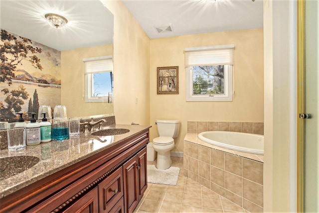 full bathroom with visible vents, toilet, a bath, tile patterned floors, and a sink