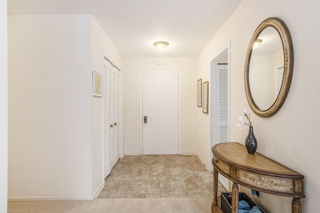 hallway featuring baseboards