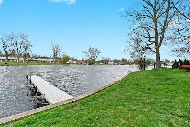 view of dock with a water view and a yard